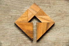 Standardized Product GTM - wood triangles assembled in a diamond with a arrow cutout in the middle